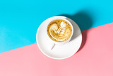 Close up white coffee cup with on blue and pink background, White cup of black coffee isolated on blue and pink background