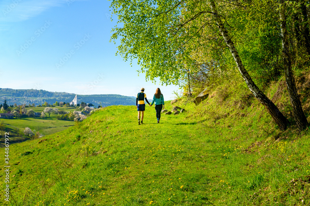 young couple in Love walking in spring beautiful morning landscape. Hrinova, Slovakia, europe