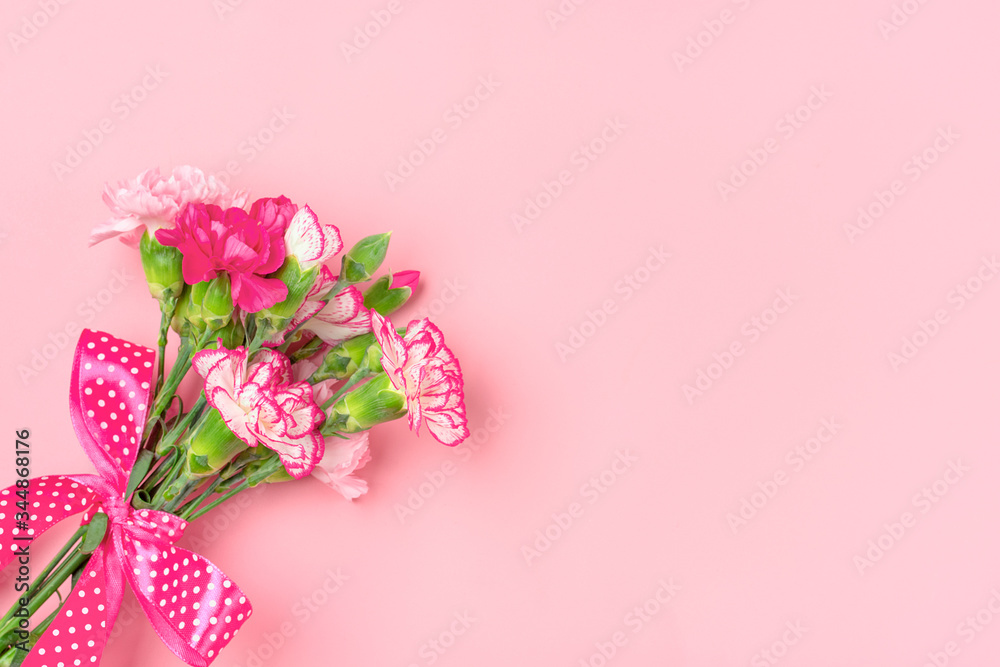bouquet of different pink carnation flowers isolated on pink background Top view Flat lay Holiday card 8 March, Happy Valentine's day, Mother's day concept bouquet of different pink carnation flowers isolated on pink background Top view Flat lay Holiday card 8 March, Happy Valentine's day, Mother's day concept