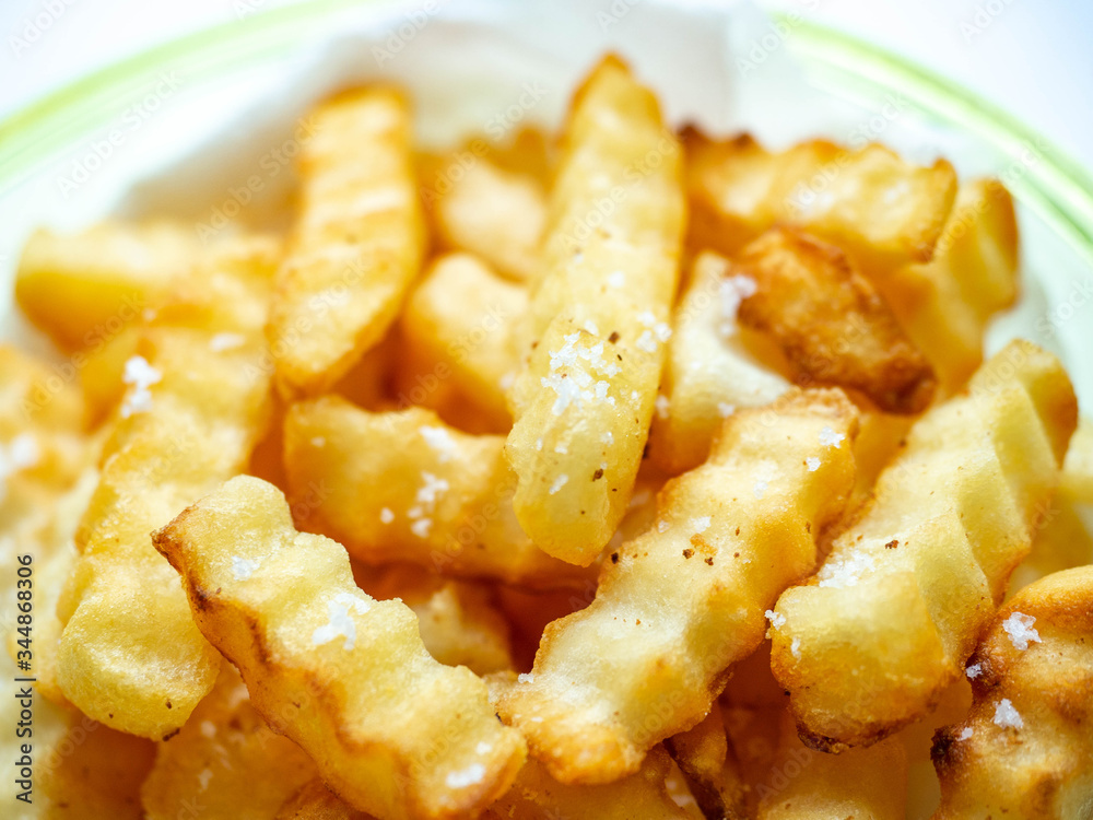 French fries golden brown, fried with oil and sprinkled with salt, sweet and salty French fries golden brown, fried with oil and sprinkled with salt, sweet and salty