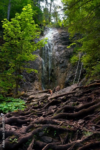 Waterfall in Slovak Paradise. Hiking with typical ladders and many different waterfalls from alpine streams.