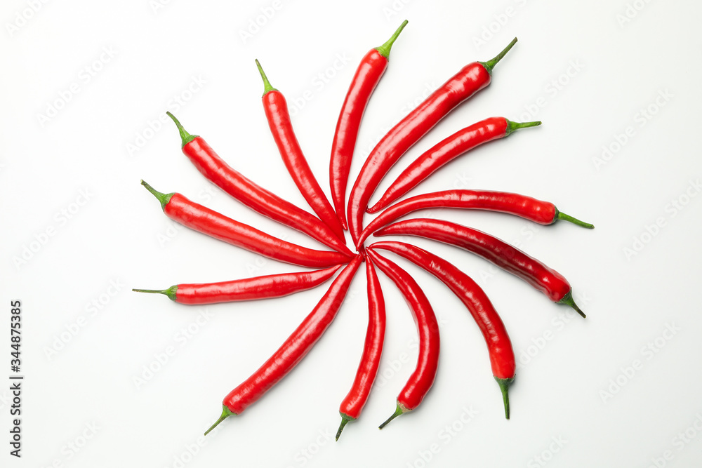 Chilli peppers on white background, top view Chilli peppers on white background, top view