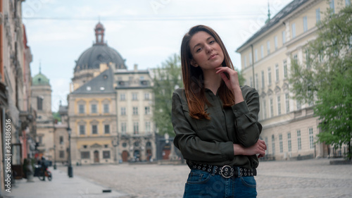 Outdoor close up portrait of young beautiful fashionable woman