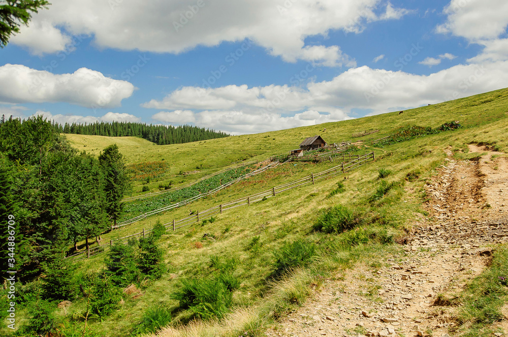 beautiful valley in the mountains and the hermit's house