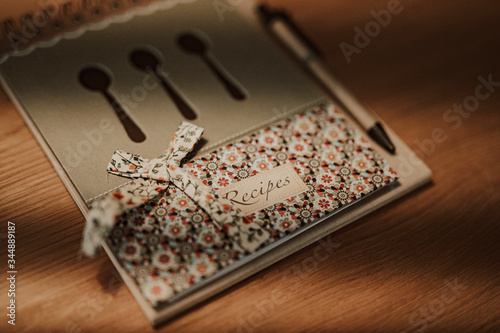 close up of an old recipes notebook on wooden table