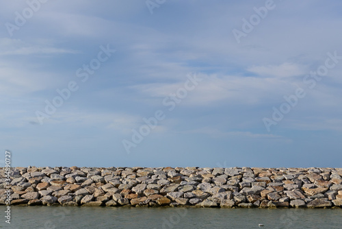Large stones Was prepared in place of the sandy beach for the wave walls