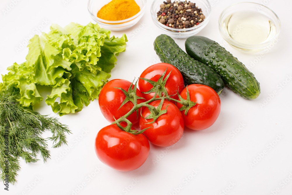 tomatoes and cucumbers and spices isolated on a white background, cooking concept. Food background.