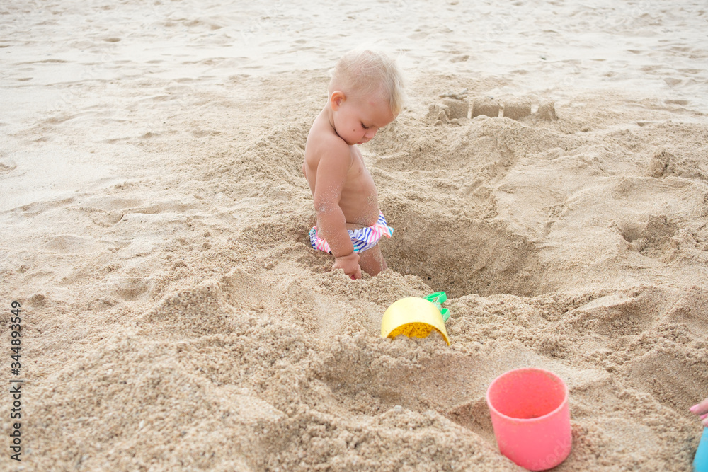 Little girl playing on beach.Vacation summer and relax concept. Little girl playing on beach.Vacation summer and relax concept.