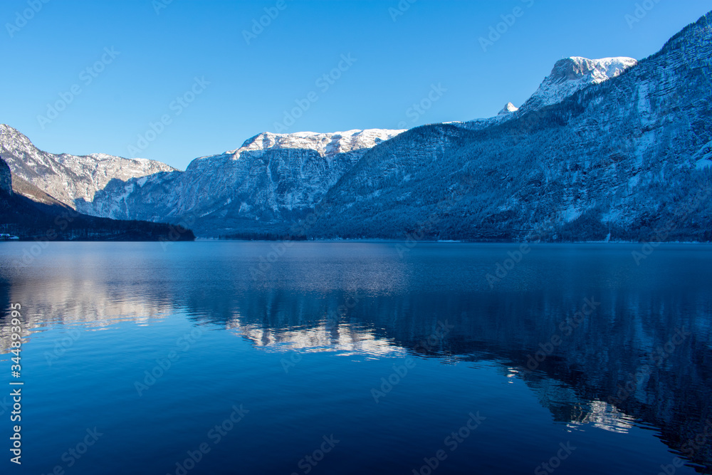 Hallstattersee lake in village Hallstatt western shore in Austria's mountainous Salzkammergut region in winter