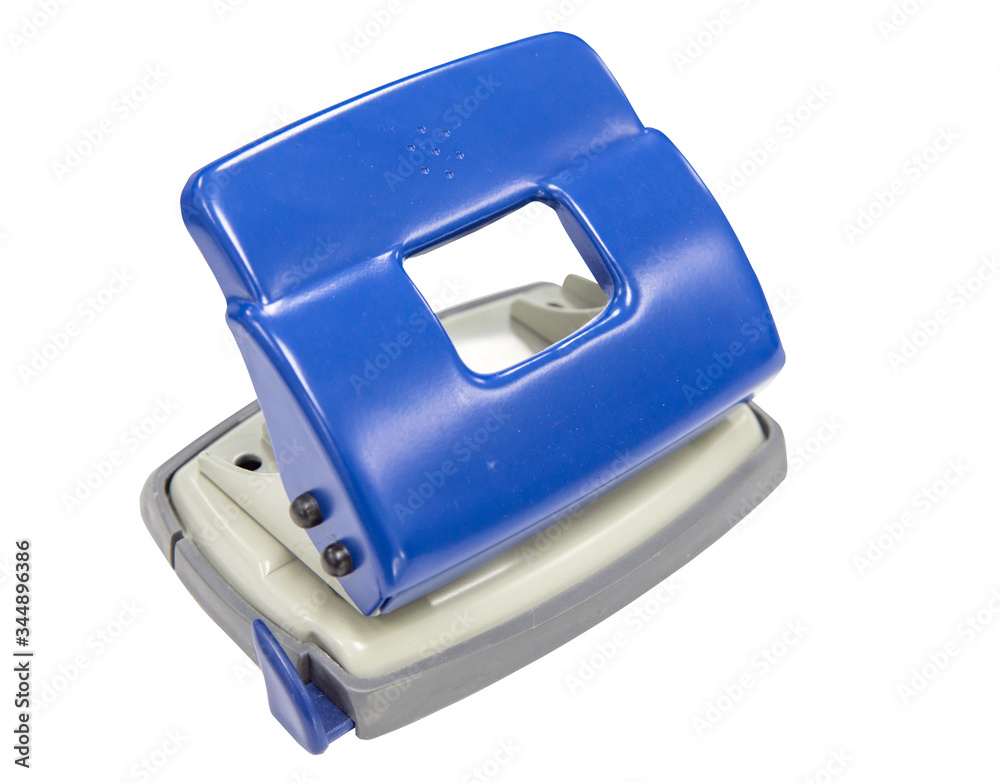 Blue puncher stationary tooling used in office on white background with clipping path Blue puncher stationary tooling used in office on white background with clipping path