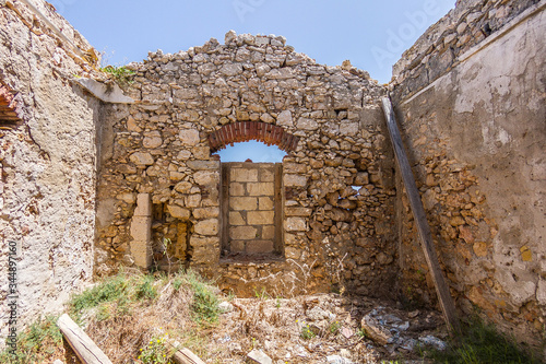 Old lighthouse on the rocks in Capo Murro di Porco near Siracusa - Sicily photo