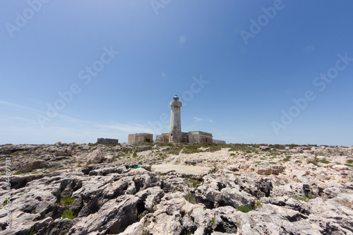 Old lighthouse on the rocks in Capo Murro di Porco near Siracusa - Sicily