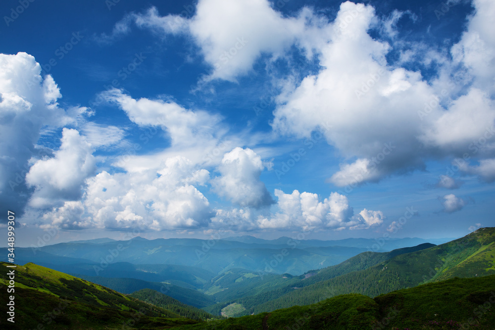 Beautiful sky with clouds and fog over the Carpathians.