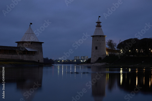 two towers on the river Bank in the night city