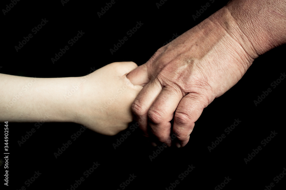 old man's and child hand old man's and child hand