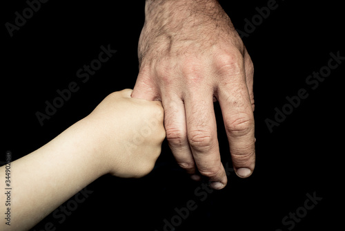 old man's and child hand