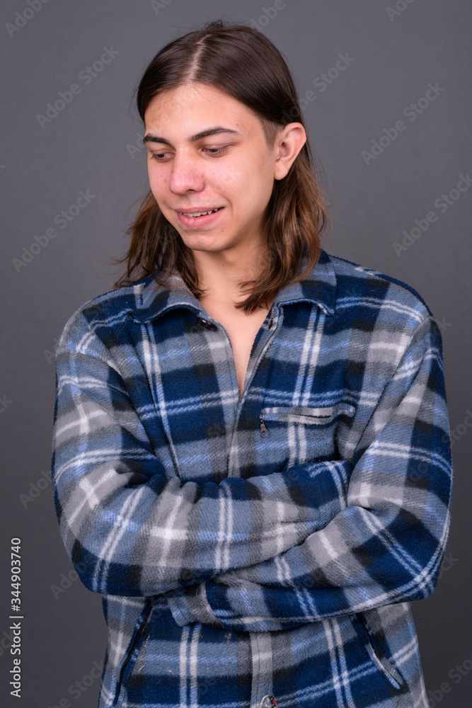 Young handsome hipster man with long hair Young handsome hipster man with long hair