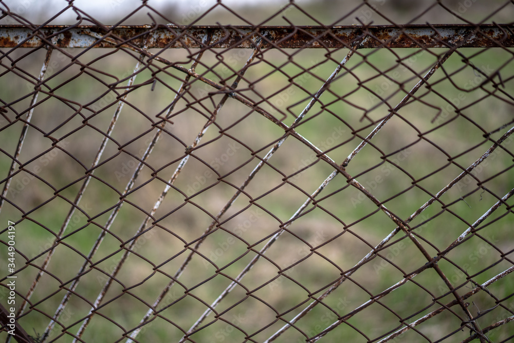 Rusty iron fence in the yard Rusty iron fence in the yard