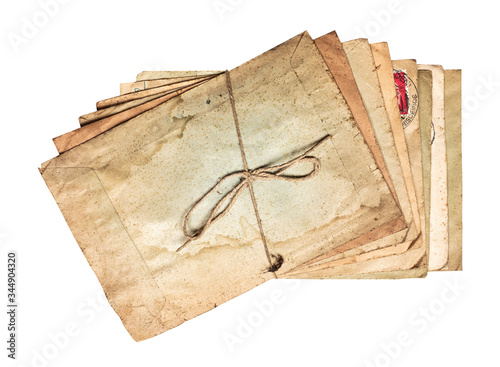 Shifted stack of worn dirty old letters tied with cord