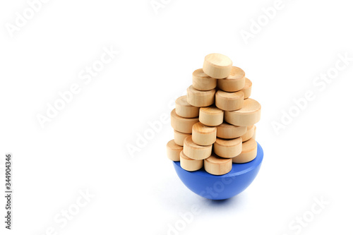 Risk management concept on white background. wooden balance game on white background