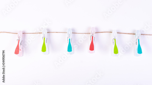 Color plastic clamp on a rope isolated on white background. © Hryhor Denys