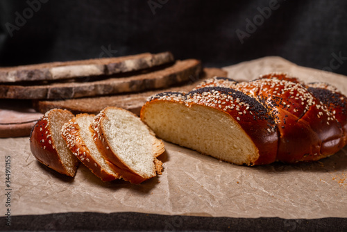 Baking, rolls, bread and milk on a dark background