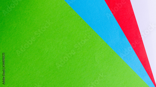 Green, blue, white and red color paper texture background.
