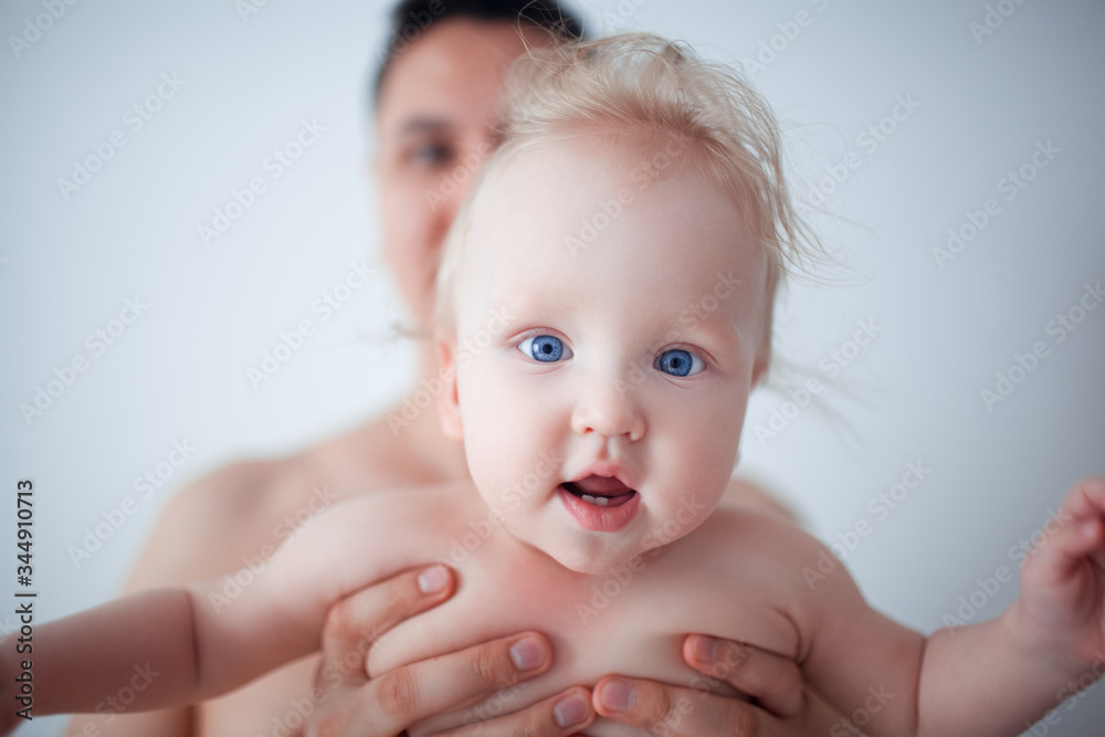 Father with his young baby cuddling and kissing him on cheek. Parenthood, love. Father with his young baby cuddling and kissing him on cheek. Parenthood, love.
