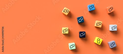 Foto many cubes with speech bubble icons on orange background