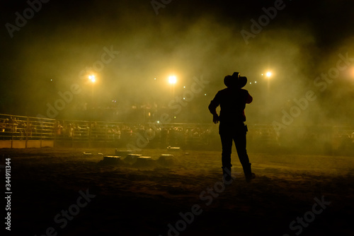Rodeo workers from Brazil. Announcer calls to the crowd during rodeo show at an arena in Brazil. photo