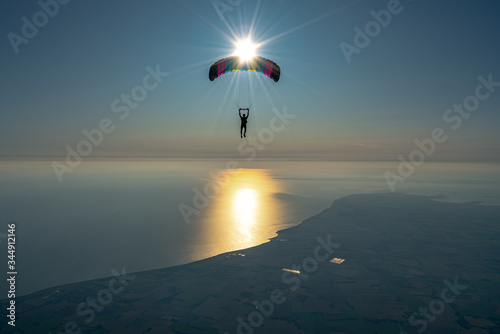 Sunset skydive over the sea