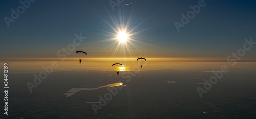 Skydive sunset over the sea