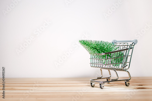 shopping cart with Christmas tree