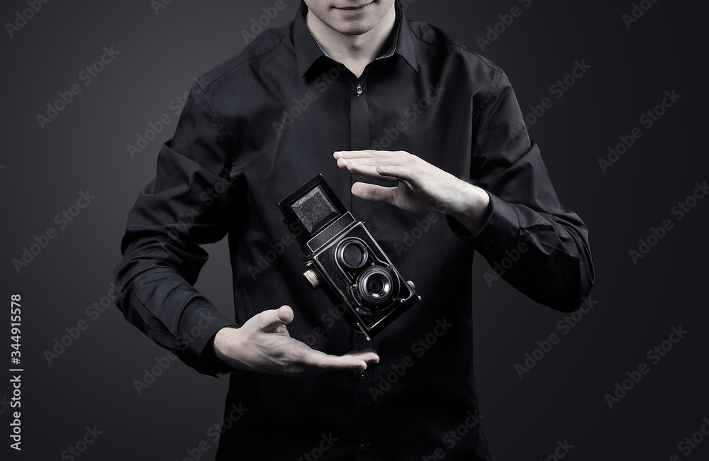 magician with an old levitating camera magician with an old levitating camera