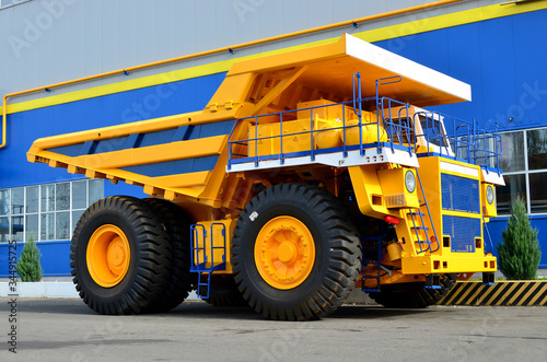 Giant mining dump truck, after being discharged from the conveyor, is tested at the factory test site. Heavy-duty truck manufacture by the heavy vehicle plant.