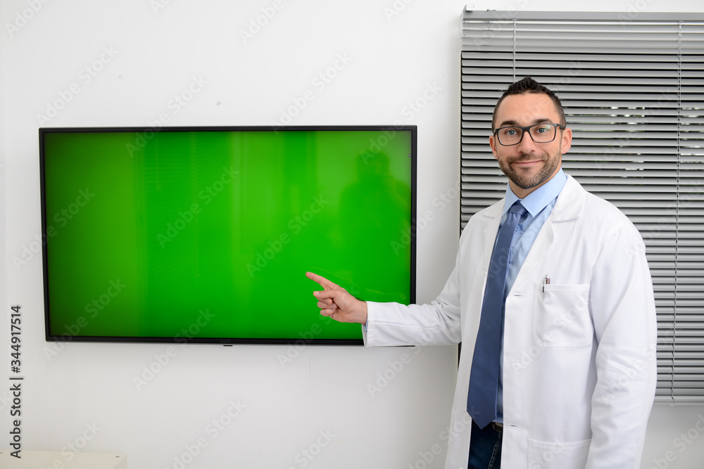 man male doctor professor teacher in medical office wearing a white lab coat and tie shirt showing to students green wall srceen research covid19 and coronavirus seminar man male doctor professor teacher in medical office wearing a white lab coat and tie shirt showing to students green wall srceen research covid19 and coronavirus seminar