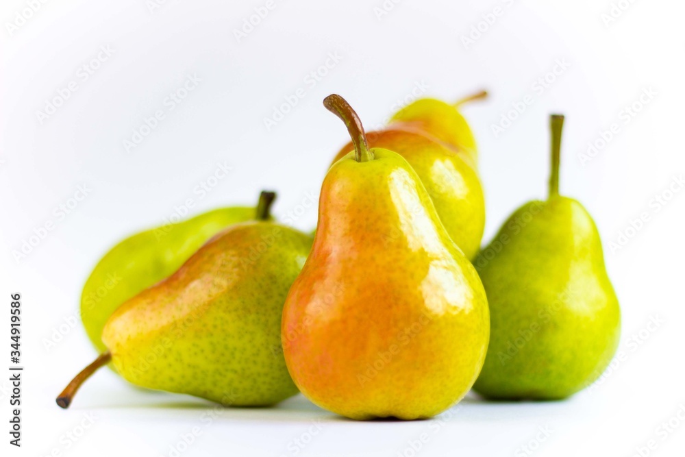 Delicious pears on a wooden tray isolated on a white background Delicious pears on a wooden tray isolated on a white background