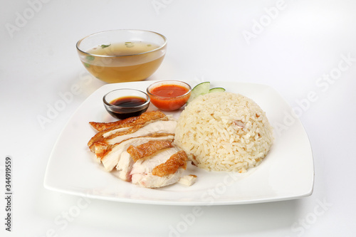 South east asian style chicken rice set steamed roasted sliced chicken with soup dark chilli sauce malaysia china