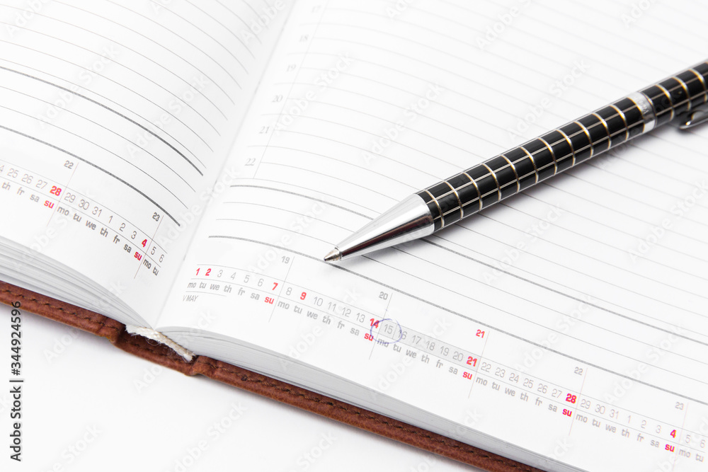 Pen and notebook on a white background, business and education. Isolated Pen and notebook on a white background, business and education. Isolated