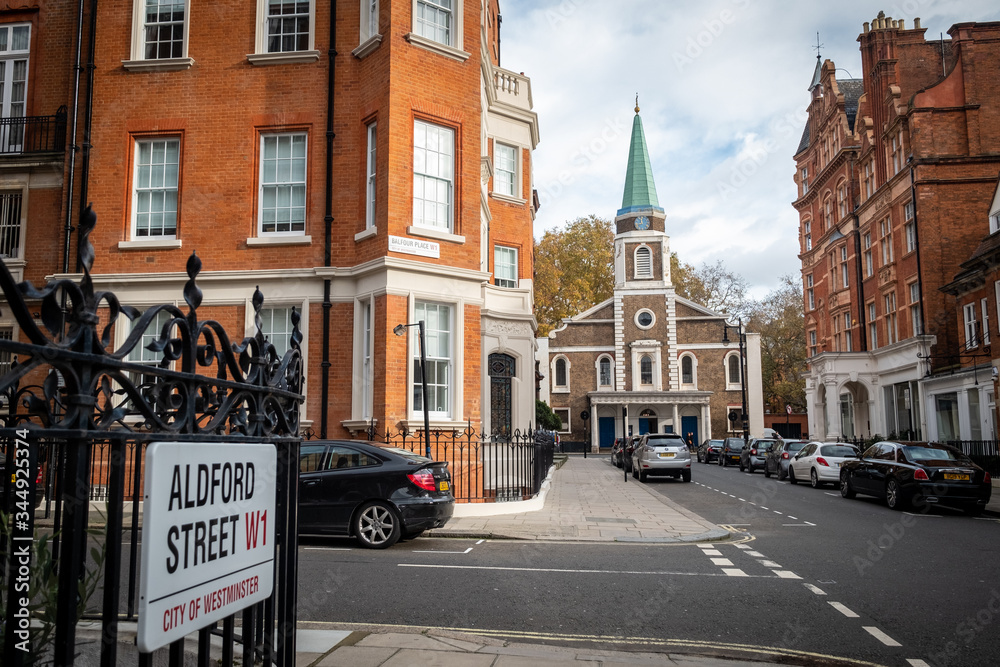 LONDON-  Grosvenor Chapel and beautiful red brick mansion buildings in Mayfair, London's West End