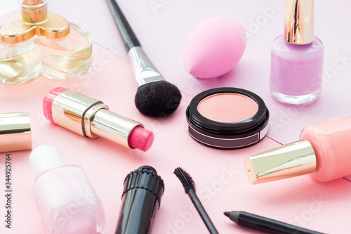 Make up products close up in a rosy background