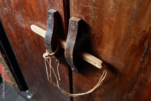 Obsolete wooden door bolt, Thai tradition