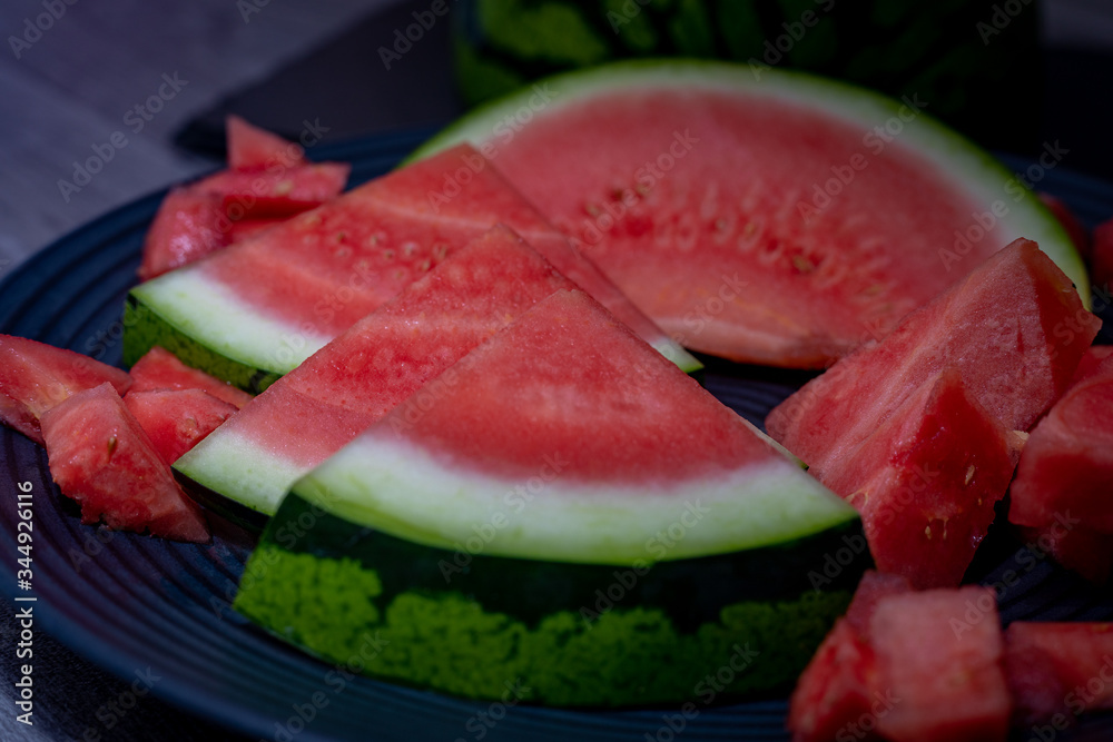 Plate with tasty sliced watermelon on table Plate with tasty sliced watermelon on table