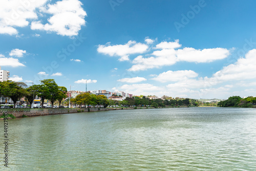 Sunny day and blue sky in lagoon in the tourist city, inland of the state Sao Paulo. Lago do Taboao in the city of Bragança Paulista, Brazil.