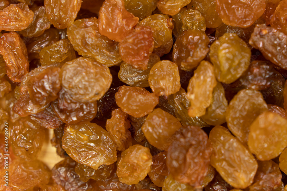 sultana raisins background close up. On wooden background