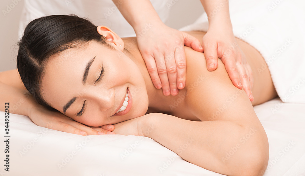 Thai Massage therapy. Portrait asian woman enjoying massage at the spa.