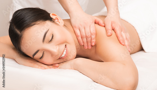 Thai Massage therapy. Portrait asian woman enjoying massage at the spa.