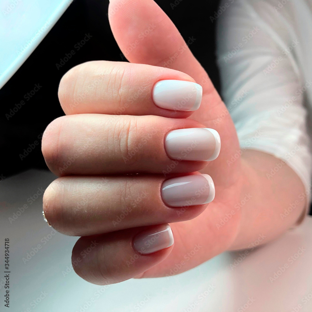 Beautiful woman's nails with beautiful french manicure Beautiful woman's nails with beautiful french manicure