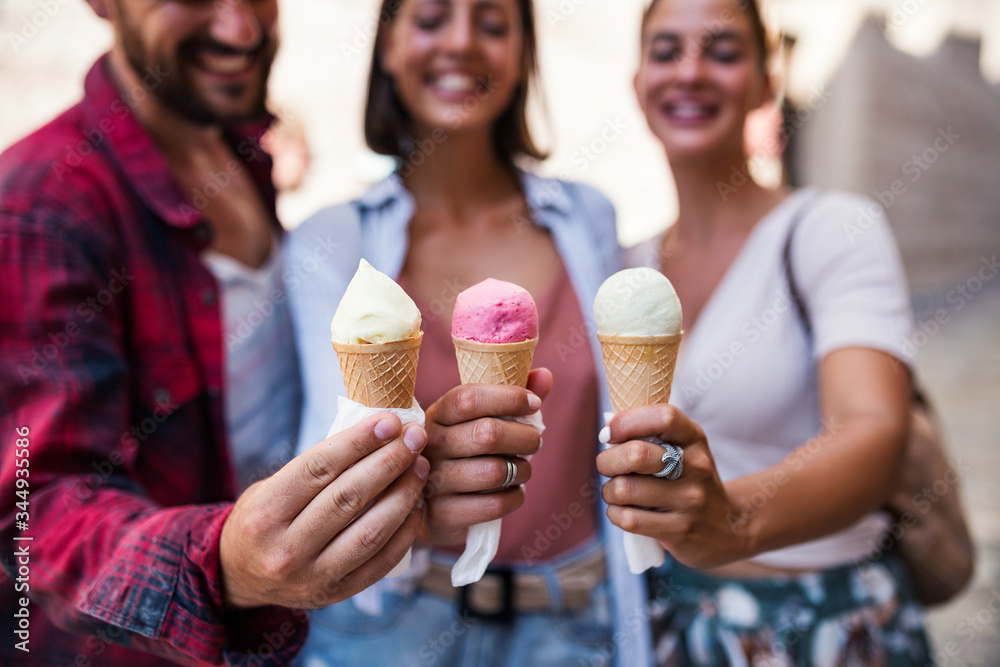 Three friends holding ice cream