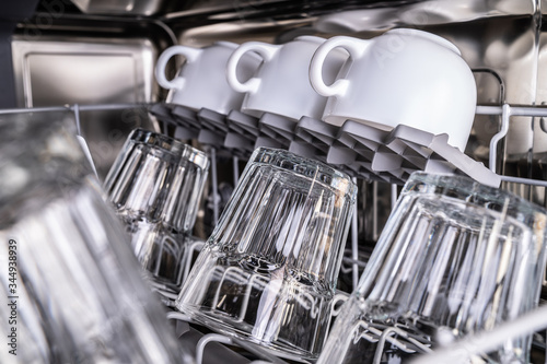 Clean cups and glasses in dishwasher photo
